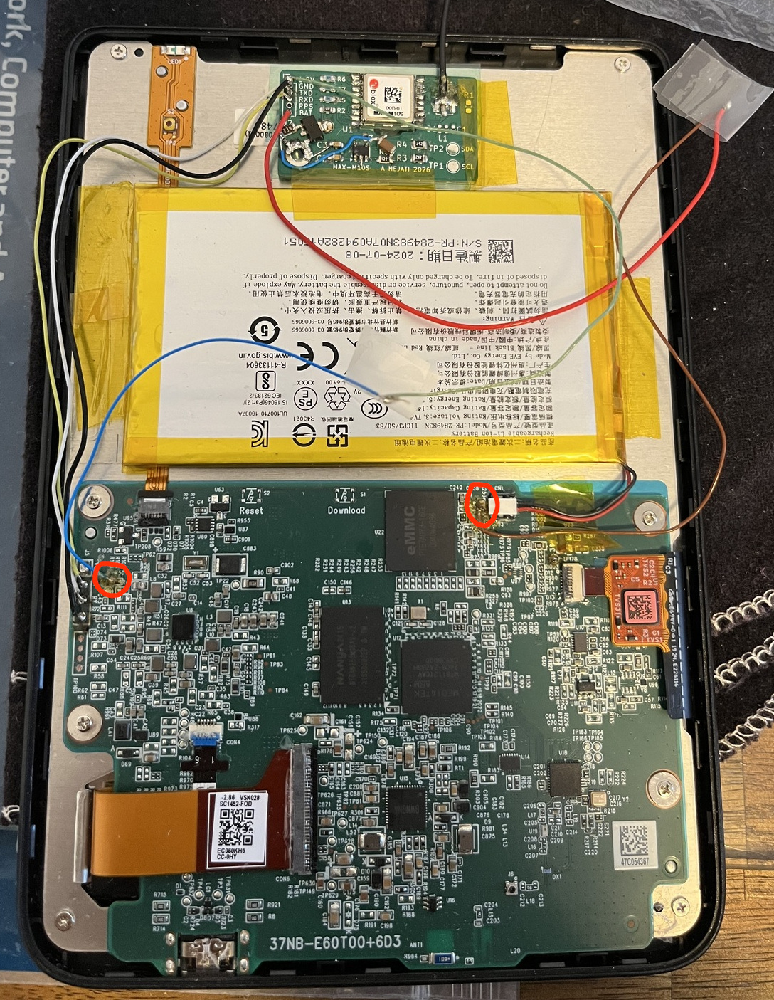 The finished GPS module seated in place inside the Kobo case.